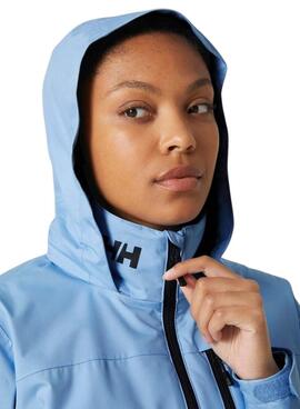 Jaqueta Helly Hansen Crew com capuz azul para mulher.