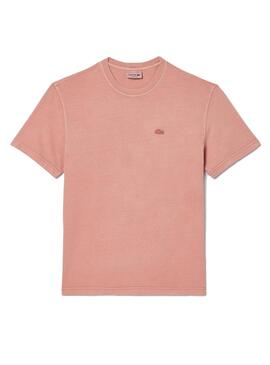 Camisa Lacoste tingida de rosa para mulher e homem.