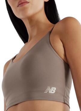 Top New Balance Harmony tostado para mulher.