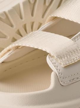 Sandálias UGG GoldenGlow Slide bege para meninas e meninos.