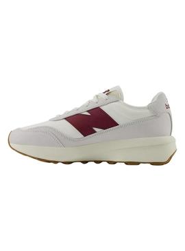 Sapatilhas New Balance U370 branco e grená para mulher e homem.
