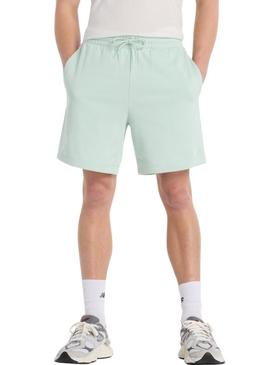 Bermuda New Balance Sport Essentials verde para homem.
