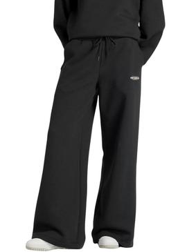 Calça New Balance Reimagined preta para mulher.