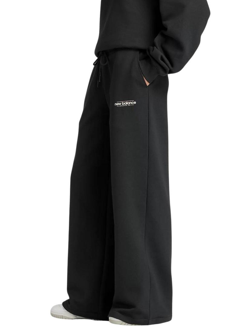 Calça New Balance Reimagined preta para mulher.