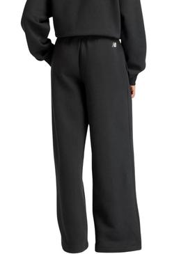 Calça New Balance Reimagined preta para mulher.