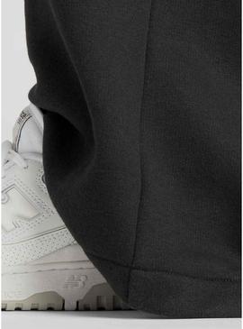 Calça New Balance Reimagined preta para mulher.