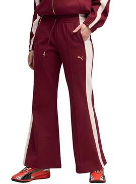 Calça esportiva Puma acampanada granate T7 para mulher.