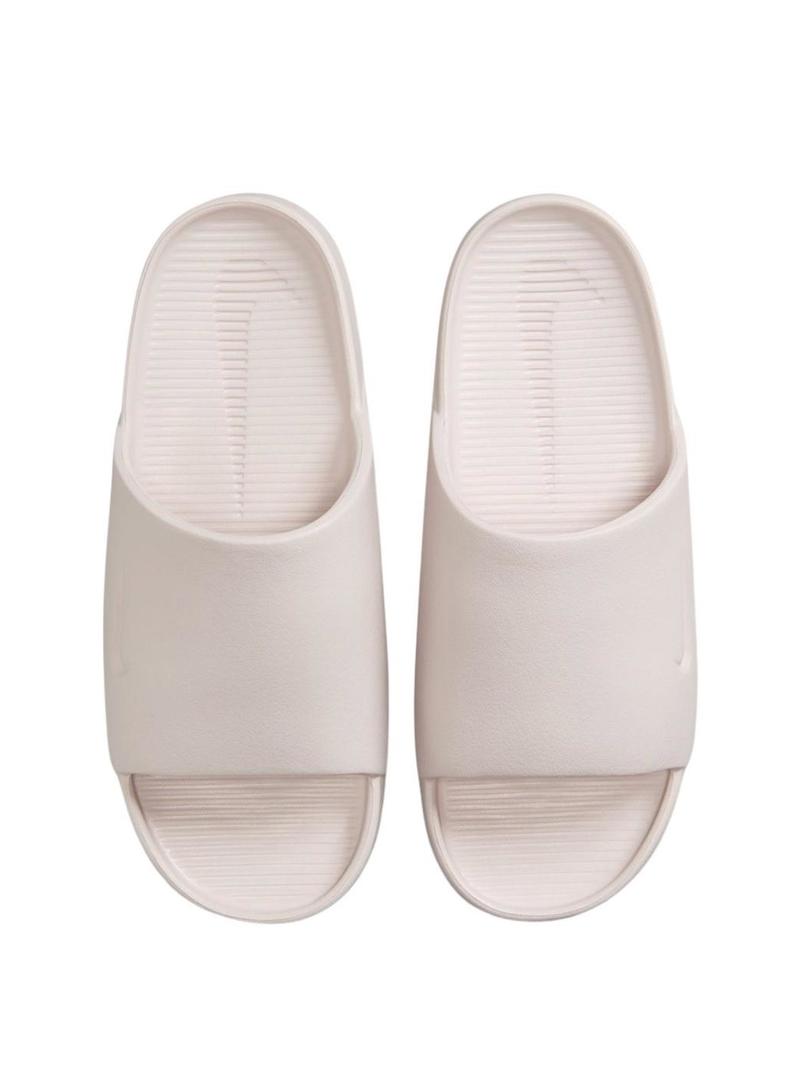 Chinelos Nike Calm bege para mulher.