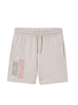 Conjunto de Mayoral bege e azul marinho para menino.