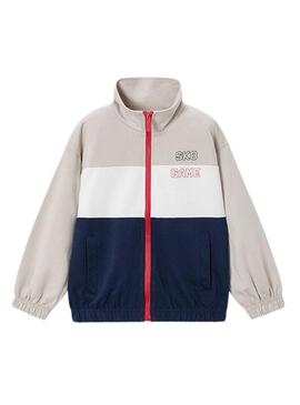 Conjunto de Mayoral bege e azul marinho para menino.