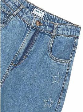 Calça jeans azul com estrelas da Mayoral para meninas.
