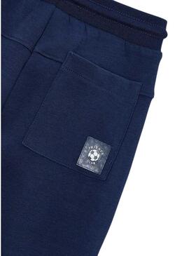 Calça jogger azul marinho com zíperes para menino.