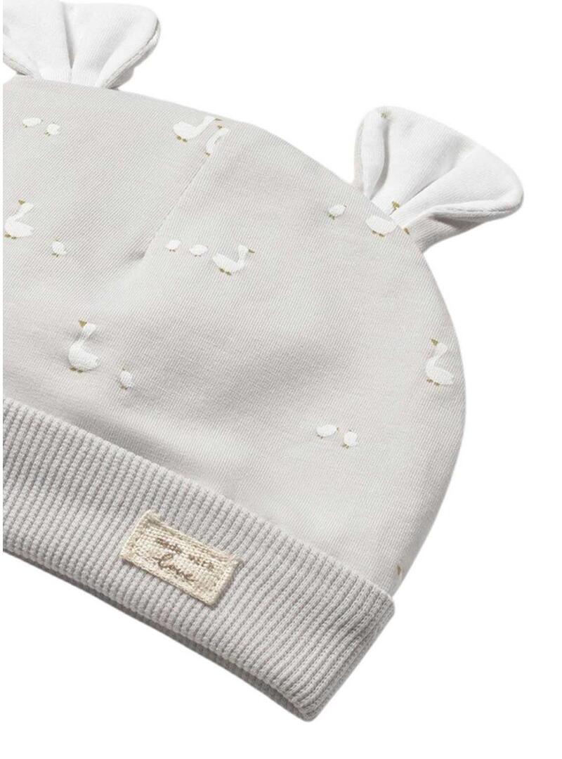 Conjunto Mayoral recém-nascido com macacão branco, babador e gorro bege para bebê.