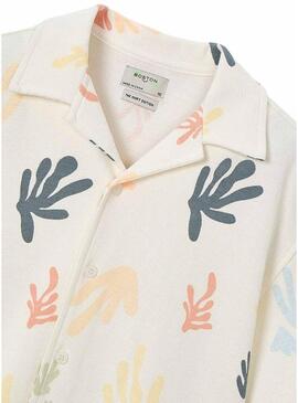 Camisa de malha estampada em creme.